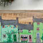 Great Tethering ton is a village which exists only in Heather's head and is inhabited by the houses themselves who love a festivity, celebration or a community event. All the efforts is made to decorate their beautiful houses for any summer fair, Christmas, or jubilee event where there's an excuse for bunting and flowers, or fairy lights!